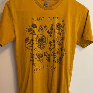 Mustard yellow graphic tee.